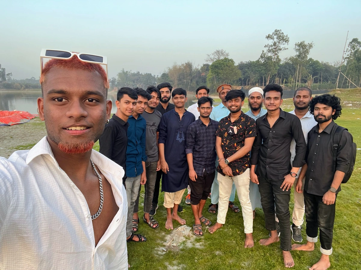 Team members capturing a joyful group selfie during the company's Ramadan Iftar celebration 2023
